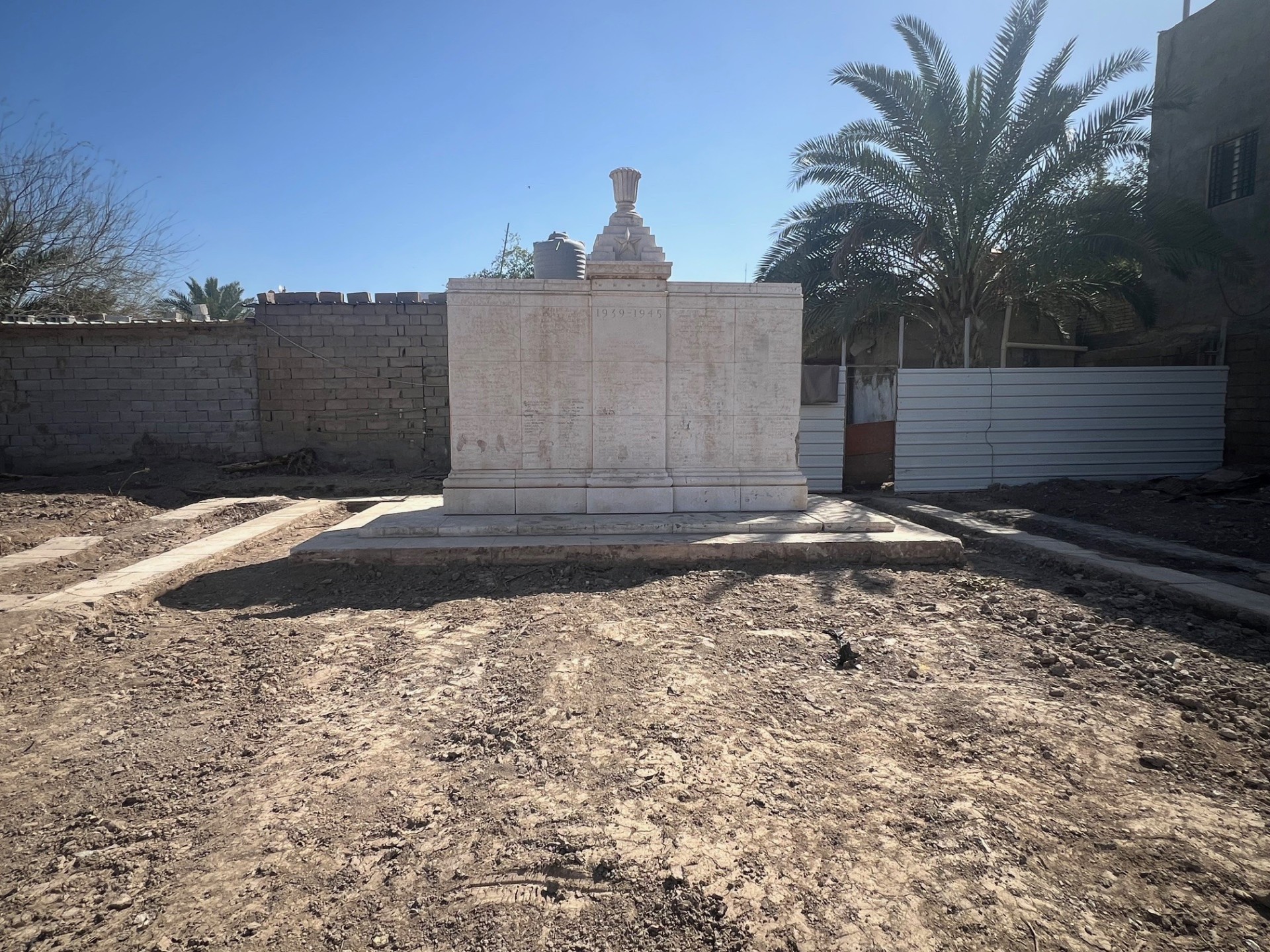 Basra War Cemetery today, bare ground where the Second World War headstones and Cremation Memorial panels once stood