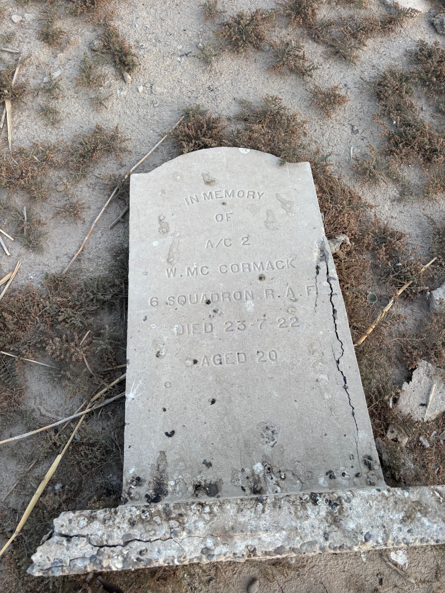 Aircraftman 2nd Class W. McCormack, 6 Squadron Royal Air Force, died 23 July 1922 aged 20. The stone is cracked from top to bottom and lies flat on the ground.
