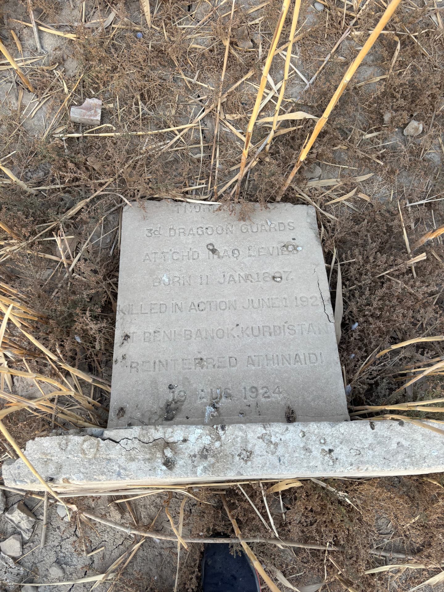 3rd Dragoon Guards, attached Iraq Levies, born 11 January 1897, killed in action June 1924 at Beni Banok, Kurdistan, reinterred at Hinaidi in August 1924. The stone is overgrown and the name eroded away.