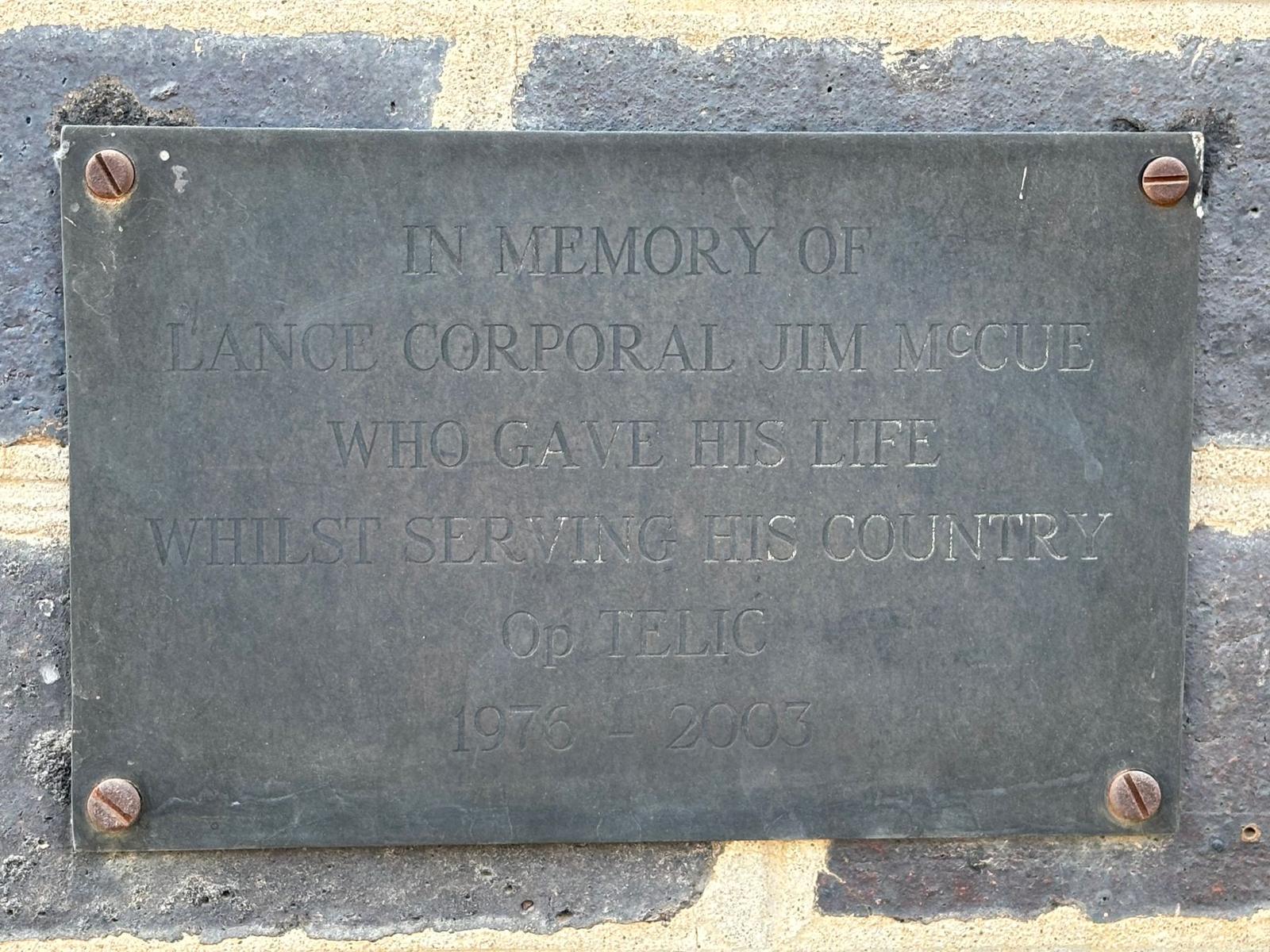 The bronze plaque to Lance Corporal Jim McCue, who gave his life on Op TELIC, 1976–2003. Added in 2004, it is the only such Op TELIC memorial left in Iraq, the others having been removed by the British Army in 2009 and re-installed at the National Memorial Arboretum in Staffordshire.