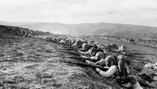 Indian Army soldiers in firing positions during the Mesopotamian Campaign
