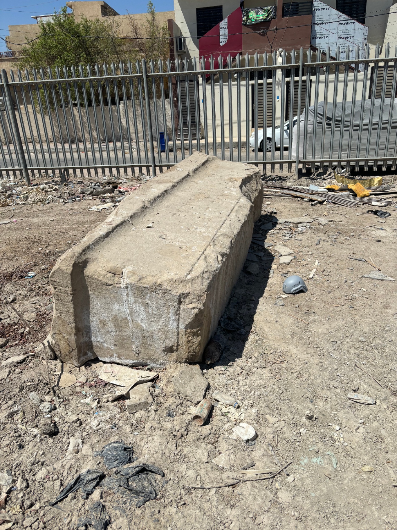 Deteriorated war memorial inscription in Iraq showing the stark reality of abandoned Commonwealth war graves