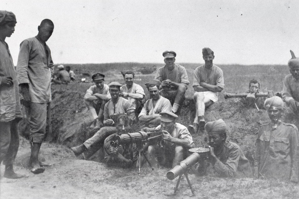 British and Indian machine gunners with a Vickers machine gun, Lewis gun and range-finder, 1917