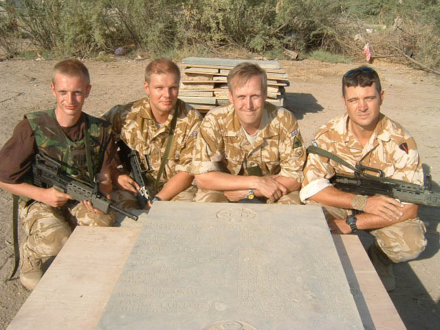 British Army personnel with a removed memorial panel at Basra War Cemetery.