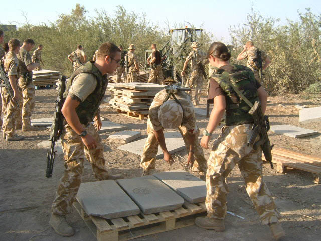 WW2 gravestones being loaded onto pallets prior to removal.