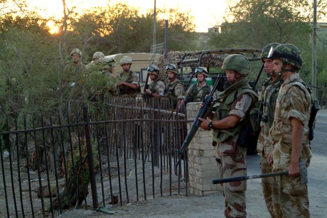 British Army personnel during demolition of the original cemetery fence.