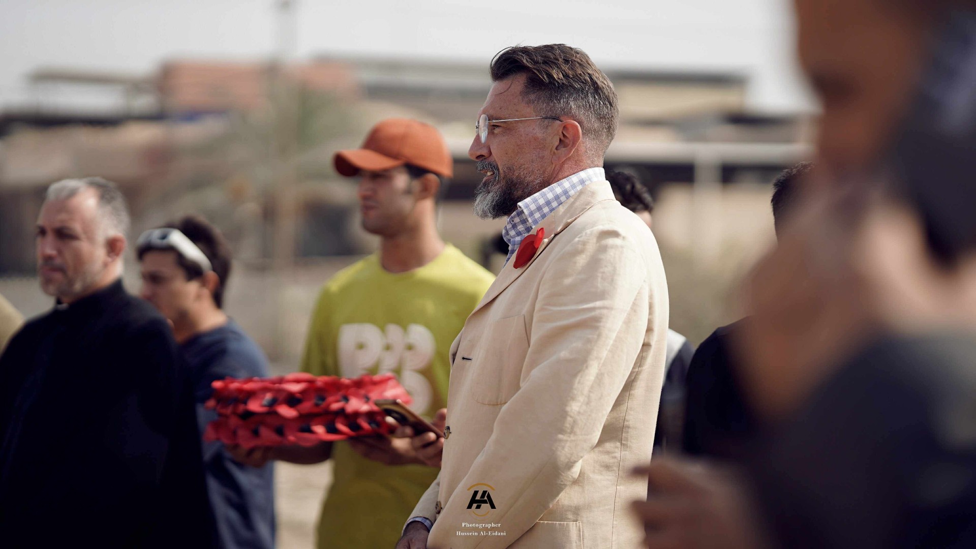 Poppy wreath being carried during the ceremony