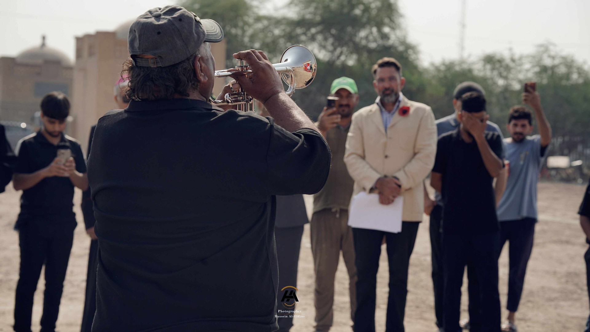 Trumpet player performing the Last Post at Basra Cemetery